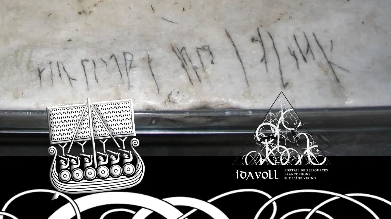 Gravure runique sur pierre, possible écriture viking prénom. Un bateau viking stylisé et le logo Idavoll sont présents.