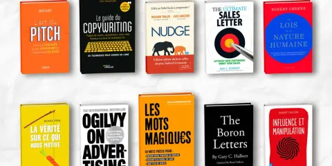 Une pile de livres sur le marketing et la persuasion, une excellente idée de livre à écrire pour les entrepreneurs.